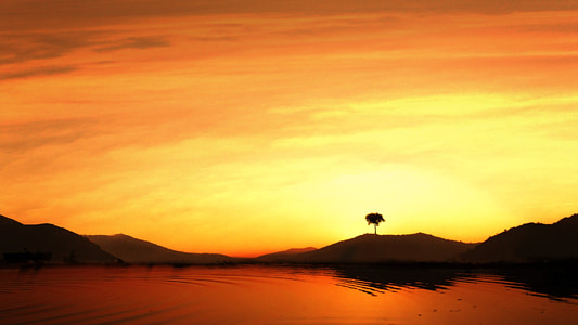 body of water during sunset thumbnail