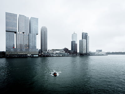 boat speeding near high-rise buildings thumbnail