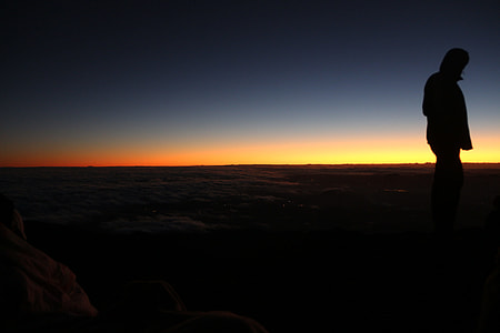 silhouette of person on orange sunset thumbnail