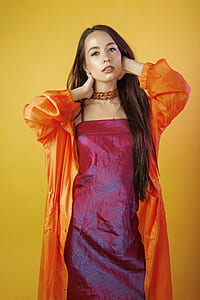 woman wearing orange coat thumbnail