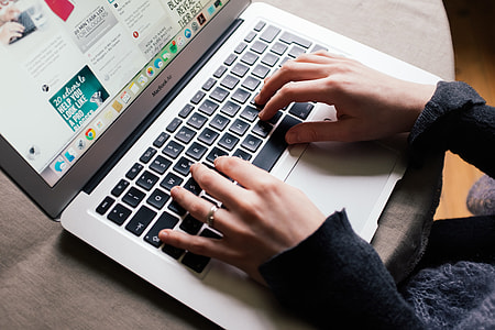 Girl is browsing Pinterest on her MacBook Air thumbnail