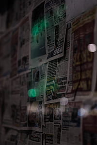 newspaper sheets on wall thumbnail