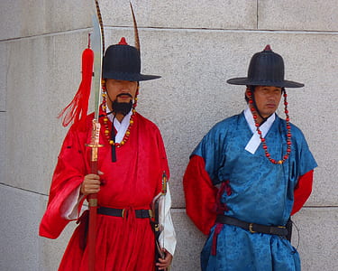 two man wearing kimono standing in front of concrete wall thumbnail