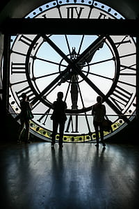 three people inside gigantic clock thumbnail