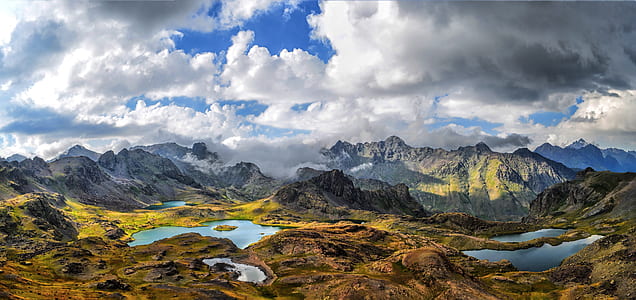 photo of mountain range with brook thumbnail