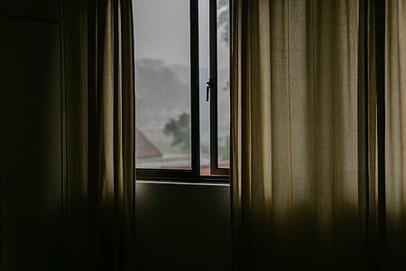 brown curtain window hang beside glass window open thumbnail