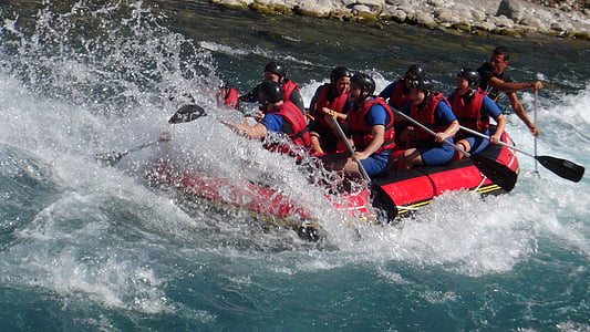people riding raft on river during daytime thumbnail