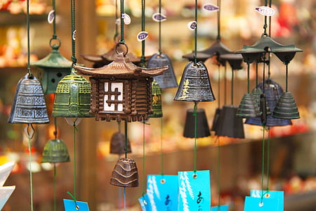 tilt shift lens photography of black and brown hanging bell lot thumbnail