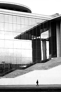 person walking on building during daytime thumbnail