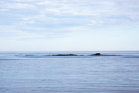 body of water during blue sky thumbnail