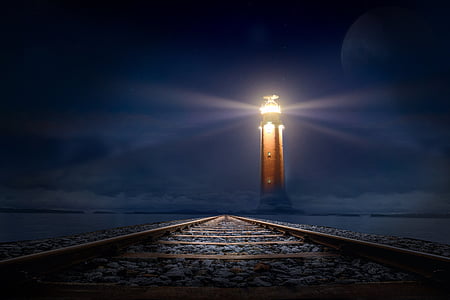 lighthouse during nighttime thumbnail