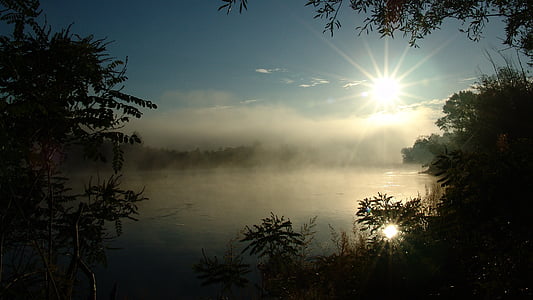 body of water with fog during sunrise thumbnail