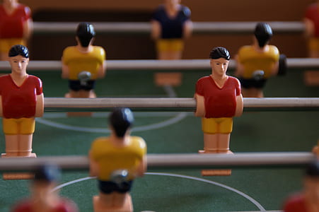 shallow focus photography of foosball table thumbnail