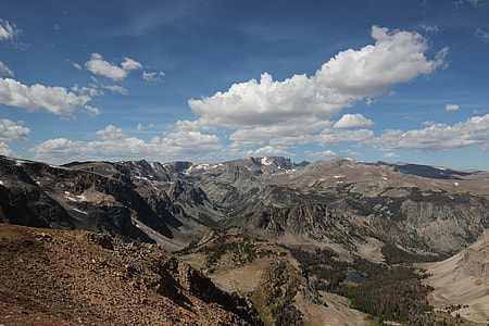 brown canyons under blue and white sky thumbnail