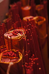 macro photography of red incense thumbnail