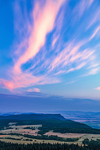 landscape photography of green field and blue and orange sky thumbnail
