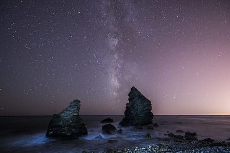 rocks on field under starry sky thumbnail