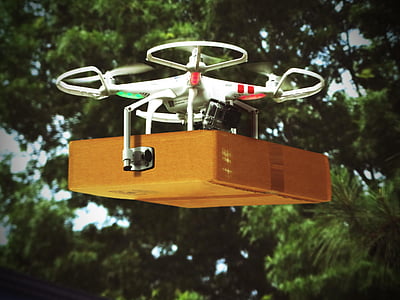 red and white DJi Phantom drone carrying brown cardboard box hovering on mid air thumbnail