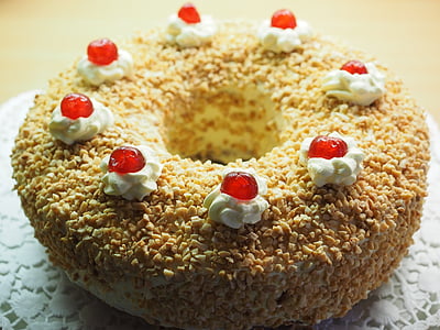 round icing covered doughnut with nuts thumbnail