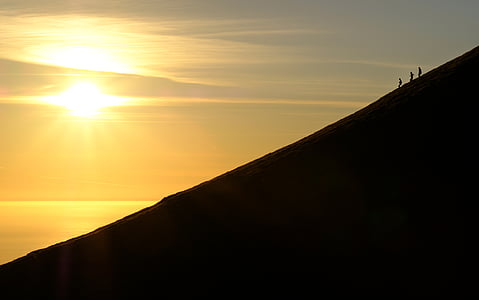 silhouette photo of three person on top of mountain thumbnail