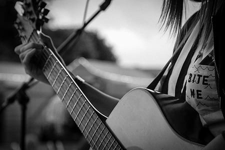grayscale photo of person playing guitar thumbnail