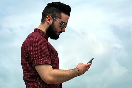 man holding smartphone thumbnail