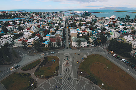 aerial photography of city fronting ocean thumbnail