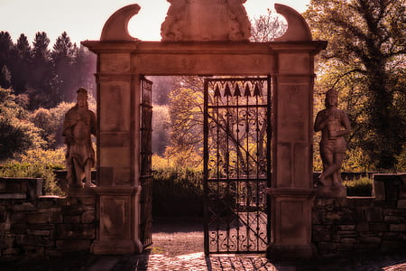 gray concrete arch gate under sunny sky thumbnail