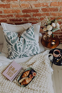 A lovely woman's bedroom with a beautiful bouquet of flowers thumbnail