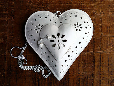 heart white laser cut leather bag on brown wooden surface thumbnail