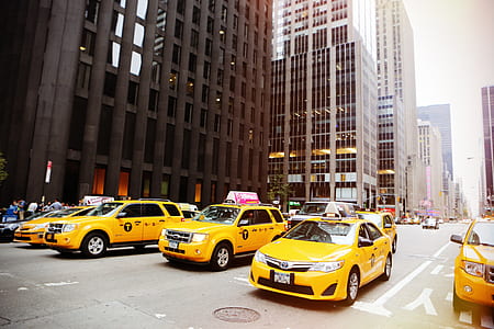 yellow taxi cars on road thumbnail