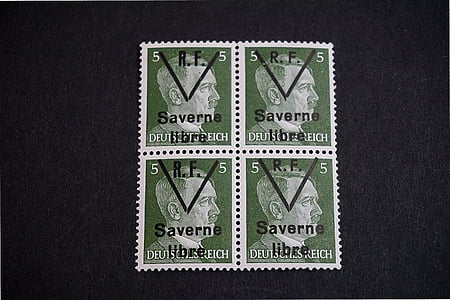 four 5 Saverne postage stamps on black surface thumbnail