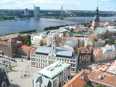 city beside lake at daytime thumbnail