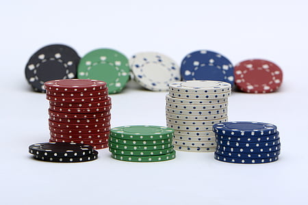 assorted-color poker chips on white surface thumbnail