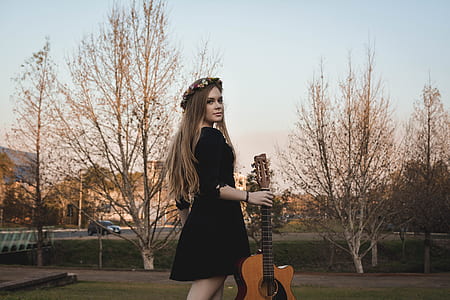 woman holding guitar thumbnail