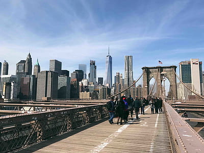 group of people walking on gray bridge thumbnail