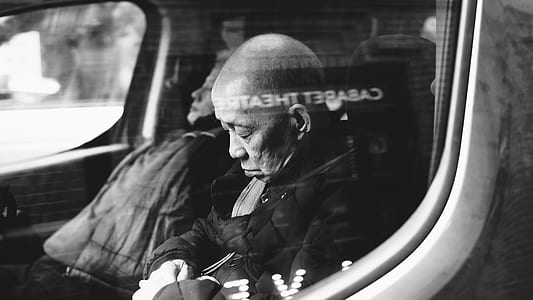 man and woman sitting inside vehicle thumbnail