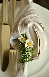 closeup photo of white petaled flowers on cloth and plate thumbnail
