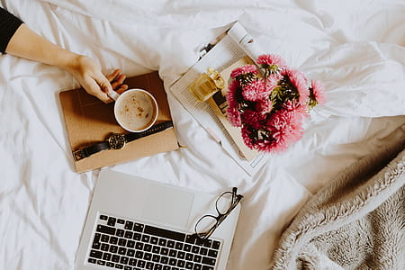 Morning coffee in bed. Working in bed thumbnail