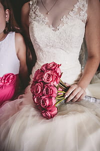 woman holding a bouquet of pink roses thumbnail