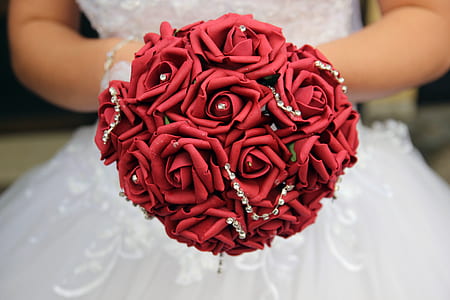woman in wedding gown holding wedding bouquet thumbnail