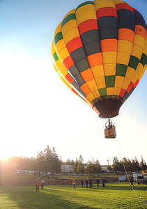 multicolored hot air balloon floating midair thumbnail