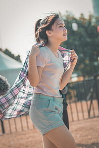woman in gray t-shirt and short shorts thumbnail