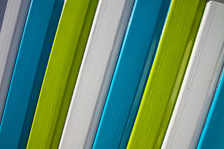 Details of brightly-coloured wooden panels, image captured in Kent, England thumbnail