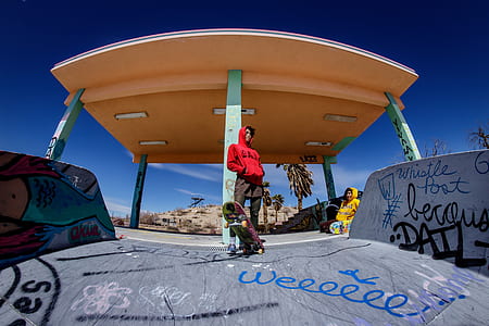 man wearing red hoodie while skating thumbnail