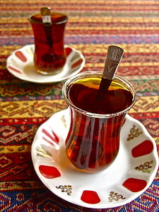 glass cup of beverage on white saucer thumbnail
