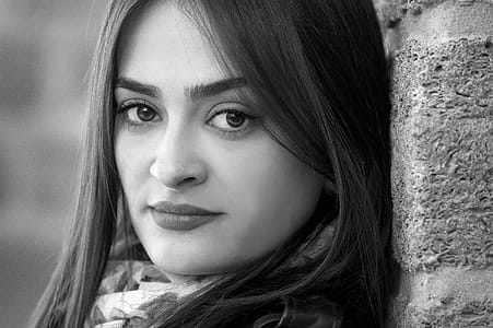 Monochrome Photography of a Woman Leaning Against the Wall thumbnail