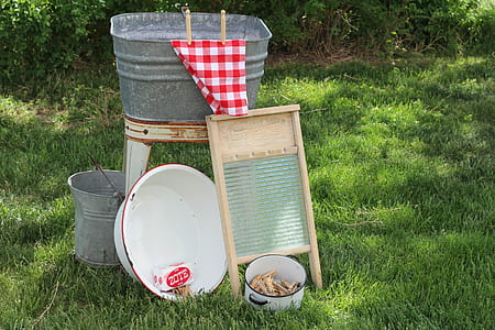 brown wooden washboard on green grass thumbnail