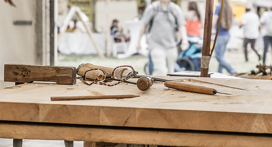 brown wooden chisel on top of table thumbnail