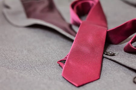 red necktie on gray blazer thumbnail